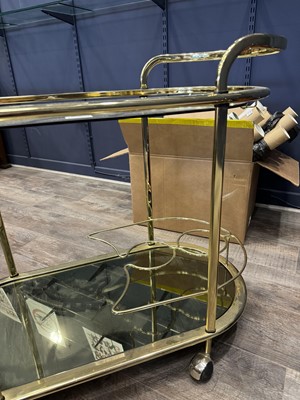 Lot 548 - ATTRIBUTED TO MILO BAUGHMAN, GILT METAL AND GLASS DRINKS TROLLEY