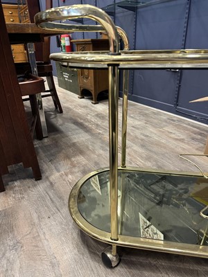 Lot 548 - ATTRIBUTED TO MILO BAUGHMAN, GILT METAL AND GLASS DRINKS TROLLEY