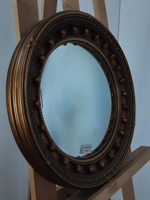 Lot 735 - TWO GILT CONVEX WALL MIRRORS