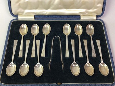 Lot 147 - SET OF TWELVE SILVER TEASPOONS AND TONGS IN A FITTED CASE