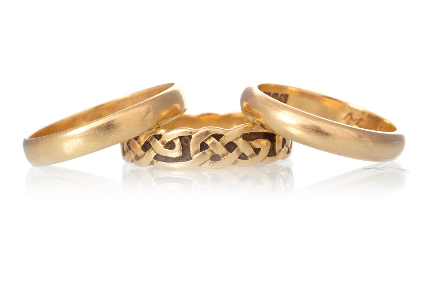 Lot 514 - THREE EIGHTEEN CARAT GOLD WEDDING BANDS