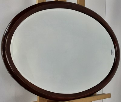 Lot 173 - MAHOGANY OVAL WALL MIRROR