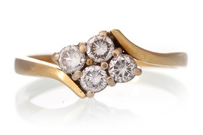 Lot 580 - DIAMOND FOUR STONE RING