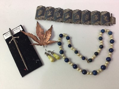 Lot 91 - TWO SIAM SILVER AND ENAMEL PEACOCK BROOCHES