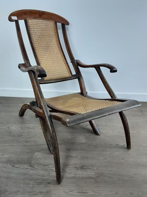 Lot 371 - VICTORIAN CANE FOLDING ARM CHAIR