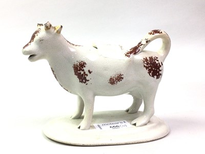 Lot 666 - VICTORIAN STAFFORDSHIRE COW CREAMER