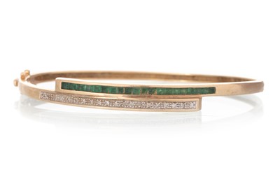 Lot 429 - EMERALD AND DIAMOND BANGLE