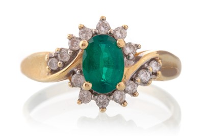 Lot 439 - SYNTHETIC EMERALD AND DIAMOND CLUSTER RING