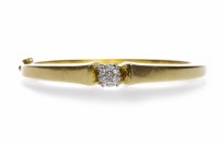 Lot 13 - DIAMOND SET BANGLE set with a central cluster...