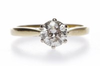 Lot 16 - DIAMOND SOLITAIRE RING the six claw set round...