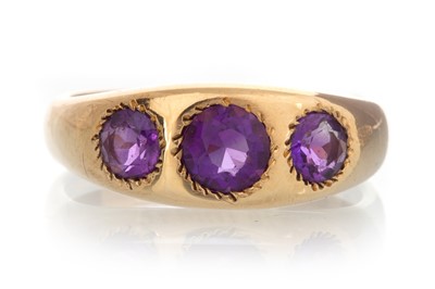 Lot 507 - AMETHYST THREE STONE RING