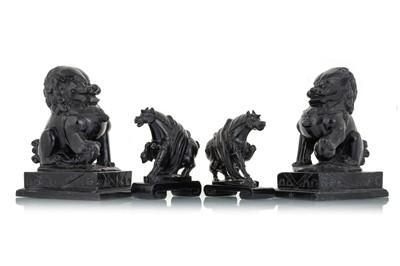 Lot 1454 - PAIR OF CHINESE BLACK HARD STONE FOO DOGS