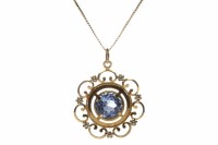 Lot 53 - BLUE TOPAZ PENDANT the round faceted topaz...