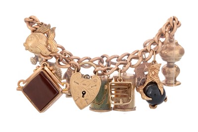 Lot 554 - GOLD CHARM BRACELET