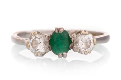 Lot 563 - EMERALD AND DIAMOND THREE STONE RING