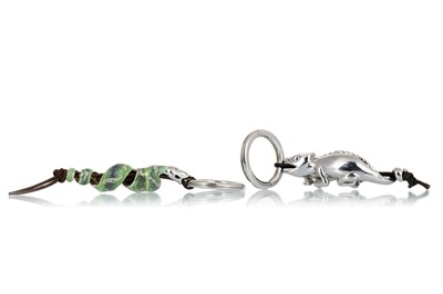 Lot 1151 - TWO SILVER KEYRINGS