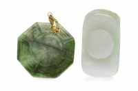 Lot 160 - CARVED SECTION OF JADE with drilled holes to...