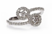 Lot 180 - DIAMOND DRESS RING formed by two diamond...