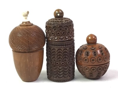 Lot 371 - THREE CARVED COQUILLA NUT BOXES