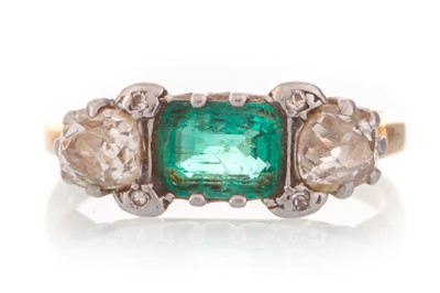 Lot 605 - EMERALD AND DIAMOND THREE STONE RING