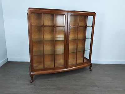 Lot 724 - WALNUT BOWFRONTED DISPLAY CABINET