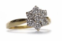 Lot 280 - DIAMOND DAISY CLUSTER RING set with round...