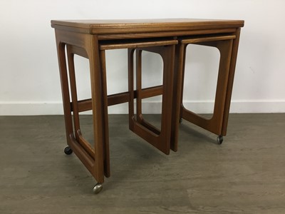 Lot 306 - A H MCINTOSH OF KIRKCALDY TEAK TRIFORM NEST OF TABLES