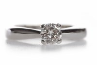 Lot 345 - DIAMOND SOLITAIRE RING the four claw set round...