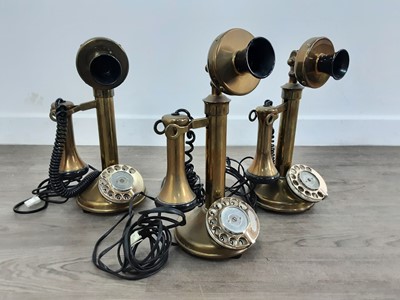 Lot 618 - THREE REPRODUCTION BRASS TELEPHONES