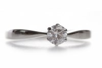 Lot 353 - DIAMOND SOLITAIRE RING the six claw set round...
