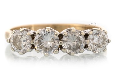 Lot 404 - DIAMOND FOUR STONE RING