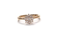 Lot 389 - DIAMOND CLUSTER RING set with round brilliant...