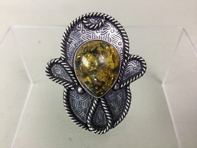 Lot 33 - SILVER AND AMBER RING