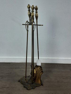 Lot 104 - SET OF BRASS FIRE TOOLS