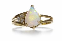 Lot 427 - OPAL AND DIAMOND DRESS RING the central pear...