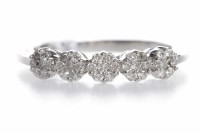 Lot 471 - DIAMOND CLUSTER RING set with round brilliant...