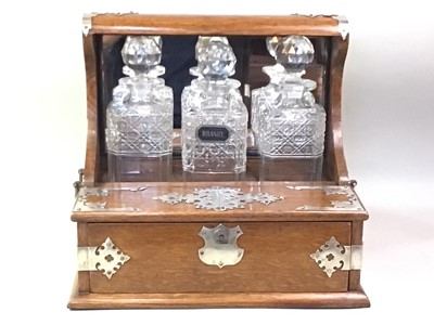 Lot 1245 - VICTORIAN OAK THREE BOTTLE TANTALUS