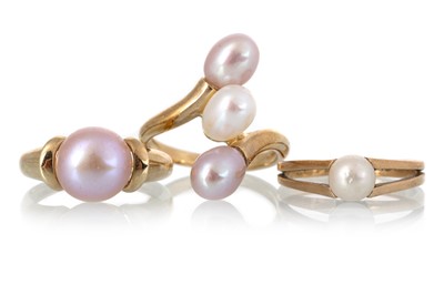 Lot 555 - THREE PEARL RINGS