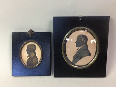 Lot 560 - TWO PAINTED MINIATURE SILHOUETTE PROFILE PORTRAITS