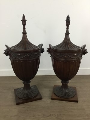 Lot 1307 - PAIR OF CARVED MAHOGANY LIDDED URNS