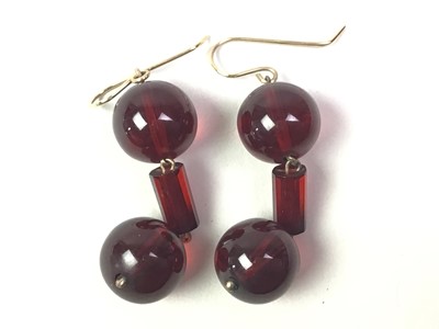 Lot 28 - THREE PAIRS OF CHERRY AMBER DROP EARRINGS