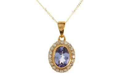 Lot 607 - TANZANITE AND DIAMOND PENDANT