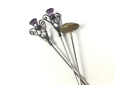 Lot 282 - TWO SILVER THISTLE END HAT PINS