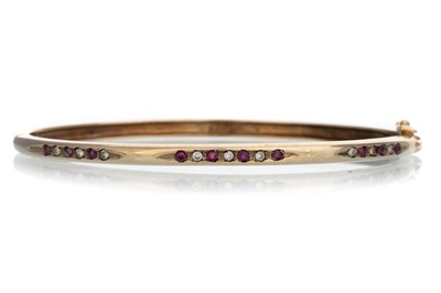 Lot 667 - RUBY AND DIAMOND BANGLE