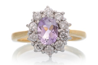 Lot 677 - AMETHYST AND DIAMOND CLUSTER RING