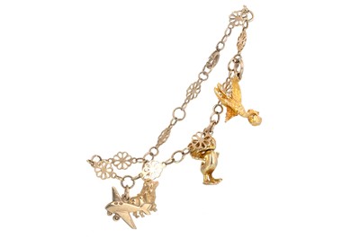 Lot 414 - NINE CARAT GOLD CHARM BRACELET