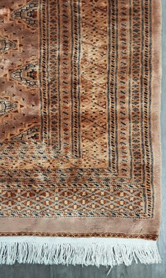 Lot 1395 - TERRACOTTA GROUND BOKHARA RUG