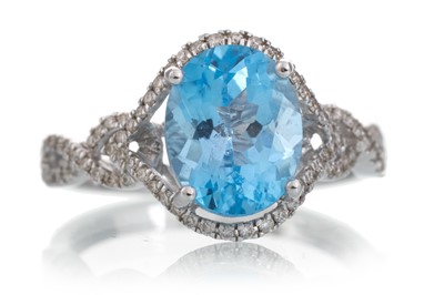 Lot 474 - TOPAZ AND DIAMOND RING