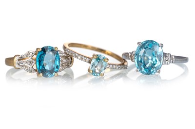 Lot 457 - THREE BLUE GEM SET RINGS