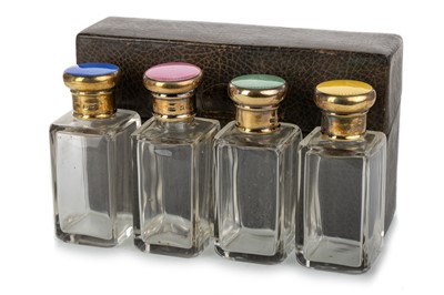 Lot 869 - SET OF FOUR GEORGE V SILVER GILT AND HARLEQUIN ENAMEL SCENT BOTTLES